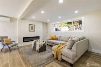 living area downstairs with fireplace