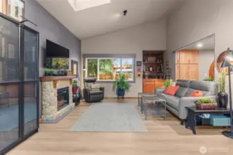 Vaulted ceilings and updated vinyl plank flooring create a wonderful atmosphere.