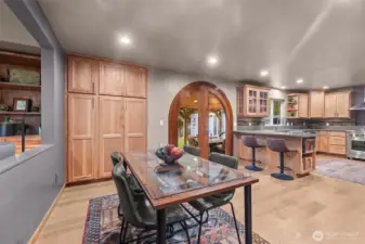 Dining area off the kitchen. Extra large pantry cabinets for extensive storage.