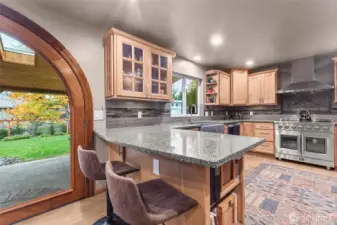 An amazing kitchen flanked by an equally amazing back yard.