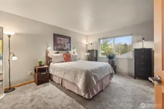 Primary bedroom is private and airy.