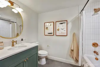 Lower level full bath with washer & dryer includes radiant heated tile floors.