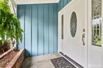 Charming covered porch offers a friendly welcome and sheltered entry into the home. The planter boxes are perfect for holiday decorations.