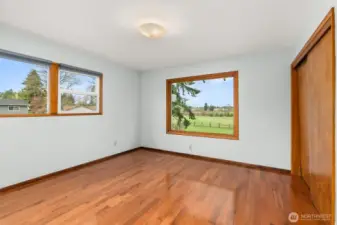 A spacious primary bedroom offering plenty of room for your furnishings and personal retreat. Generous layout, peaceful atmosphere, and convenient access to the home’s upper-level baths make this the ideal place to unwind.