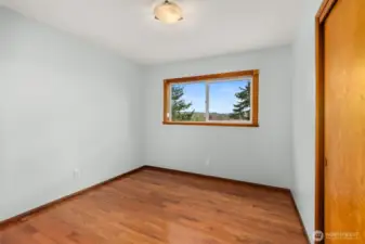 Bedroom 2  Bright and comfortable second bedroom with a well-sized closet and flexible space for a guest room, nursery, or hobby area. Warm natural light makes it inviting throughout the day.