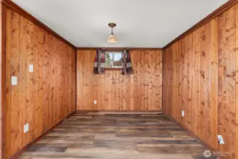 Lower-level living area features a convenient nook that creates an ideal space for a home office or work-from-home setup or even an additional bedroom space.