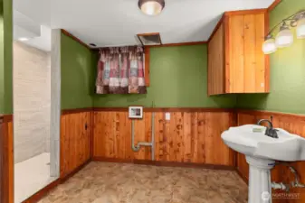 Beautifully updated lower bath complete with a tile walk-in shower that is modern and stylish, and perfect for the lower level added living space or guest convenience. Laundry area with hookups ready for your preferred appliances, plus an on-demand hot water heater for energy efficiency and continuous supply of hot water.