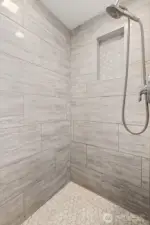 Modern tile shower in the lower bathroom.