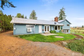 Backyard offers space for a fire pit and convenient access to the wood shed—perfect for cozy evenings.