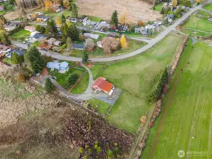 Bird’s-eye view of the house, shop/barn, and surrounding pasture—plenty of room to spread out.
