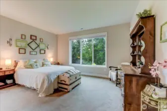 Primary Bedroom with Three Quarter Bathroom complete with His & Her Sinks, Glass Surround Shower, and Spacious Walk-In Closet