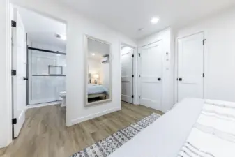 Primary bedroom with ensuite bath and walk-in closet