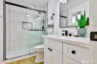 Primary bedroom with ensuite bath and walk-in closet