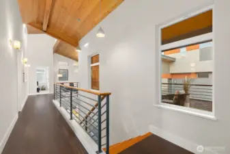 Large landing separating the primary suite from the rest of the rooms