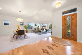 Bright entry, large coat closet, hardwood floors enhance welcoming charm.