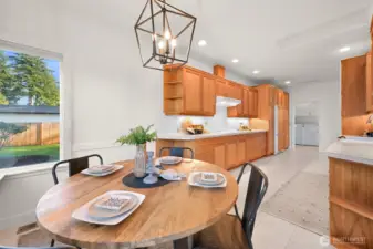 Spacious kitchen and dining nook designed for comfortable living.
