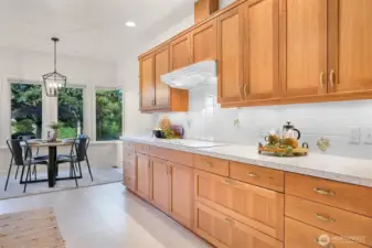 Elegant cherry cabinetry, crafted by a renowned designer, durable and classic.