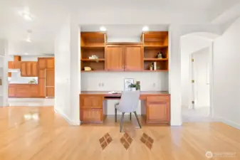 Built-in office desk credenza with integrated lighting for functionality.