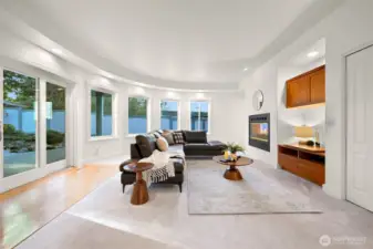 Family room opens to covered patio with a tranquil water feature.