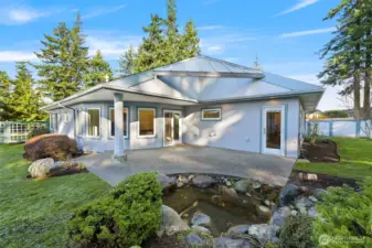 Patio view showcases family room and door to primary suite.