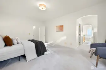 Primary suite with ensuite bath and spacious walk-in closet.