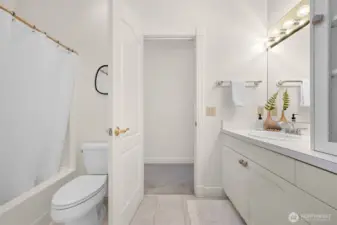 Guest bath conveniently serves both guests and family.