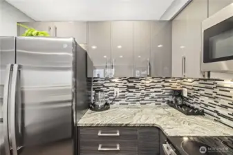 Granite countertops, tiled backsplash, plenty of storage space...