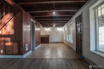 Entry way and Dining Room from Living Room showcasing natural timber beams