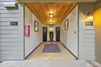 Complex has gated entry that leads to this hallway shared with one neighboring unit.