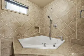 Deep soaking tub in primary bath.