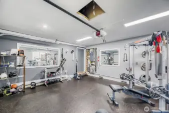 Double car garage is currently use as a personal gym with a finished floor & walls