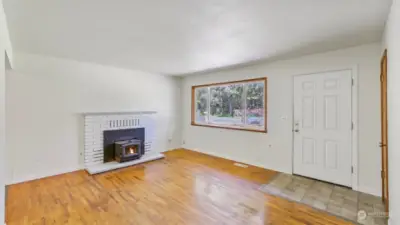 Enter this home and fine the original hardwood flooring along with a cozy fireplace.