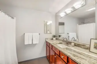 Prepare to be dazzled by this stunning vanity, the custom cabinetry, gorgeous tile and spacious luxurious presence of this primary bathroom!