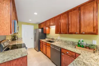 Have a closer look at the stunning cabinetry! Dark appliances look modern, and the double sink is a must!