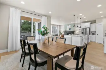 Open concept dining area to kitchen and family room