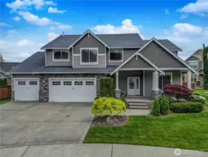 Breathtaking Mt. Rainier views in this stunning Southwood neighborhood home in Sunrise! Built in 2011 with current upgrades.  This 4-bedroom + den, 2 + 3/4 bath beauty offers 3,347 SF of refined living space.  Entertain with ease in the expansive great room and chef’s kitchen featuring stainless steel appliances, gas cooking, and an oversized, unencumbered “working” island.  The massive 5-car garage (1,275 SF!) includes backyard, garage door access, utility sink, work bench and lots of shelving for storage.  Upstairs is a huge a bonus flex-space . Use for your recreation room or home theater.  Relax in the luxurious primary suite with 5-piece bath, soaking tub, walk-in closet, and endless mountain views.     Enjoy a large, fenced backyard, a covered entertainment patio, and access to Sunrise amenities—parks, tennis courts, and more. Prime South Hill location, Puyallup Schools—this is the one!