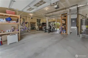 Incredible 1200+ SF Garage! Could hold up to 5 cars! 3 garage doors, 2 garage door openers. 1 garage door opens to backyard for easy access and storage. There's even a utility sink in the garage near the work bench. Lots of built -in storage, too!