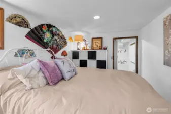 Lower level bedroom could be considered a secondary primary bedroom. with walk-in closet