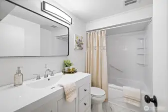 ADU bathroom, new vanity, mirror, and light
