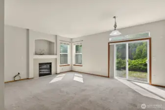 Family room with sliding glass doors that open onto the backyard patio