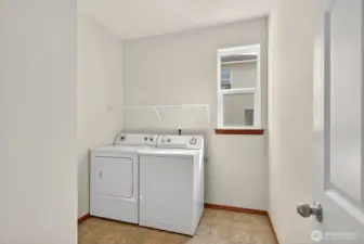 Utility room with room for storage located on the main floor