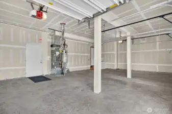 Three car garage with door to the side yard