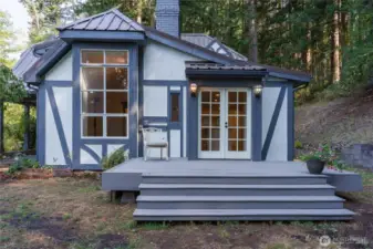 French doors off the kitchen leads to a new deck and the backyard and garden space
