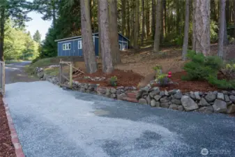 Freshly graveled driveway looking back towards the shop and Barnacle Ln