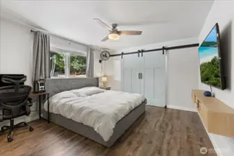 Primary Suite w/ double barn doors + an extra deep closet.