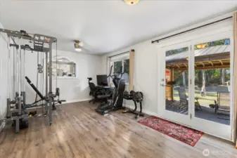 Another shot of the family room w/ a glass door to the backyard & patio.