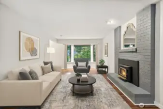 **Virtually Staged Living room- Bay window perfect for a reading area and enough space for a cozy family room set up by the fireplace.