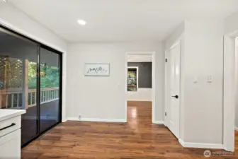 Large sliding door off kitchen brings you out to the side deck.