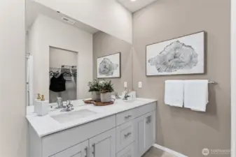 Double vanity with quartz countertops, and soft close cabinet doors. Actual home is under construction. Colors, materials, and features may vary. See site agent for details.