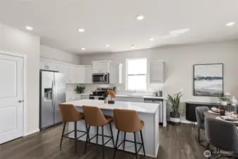 Open concept design with large pantry. Actual home is under construction. Colors, materials, and features may vary. See site agent for details.